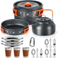 Camping cookware set with pots, pans, kettle, cups, and utensils on a white background