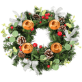 Decorative wreath with candles, pine cones, and berries on a white background