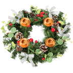 Decorative wreath with candles, pine cones, and berries on a white background