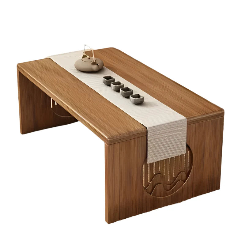 Wooden tea table with a white runner and tea sets on a tatami mat floor.