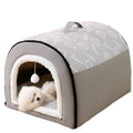 Pet bed with a gray and white patterned roof and white interior, featuring a small white dog inside.